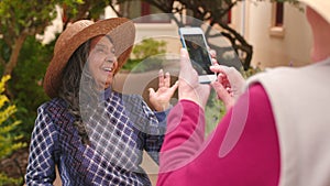 Trendy woman, taking picture and senior friends posing for social media photo with phone while feeling happy and playful