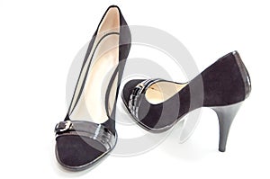 Trendy womens medium heeled court shoes on white background.