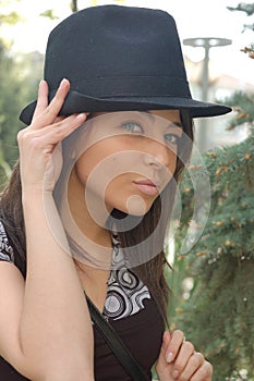 Trendy young woman in hat