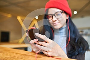 Trendy Young Woman Holding Smartphone