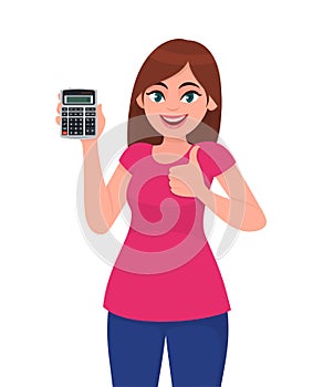 Trendy young woman showing, holding calculator and gesturing thumbs up sign. Modern stylish girl making like, good or positive.