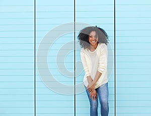 Trendy young woman smiling outdoors