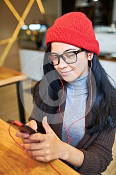 Trendy Young Woman using Smartphone