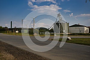 TRENT, GERMANY - May 09, 2020: Trent, Schleswig-Holstein, Germany,  May 9. 2020 Biogas plant in background wind turbines