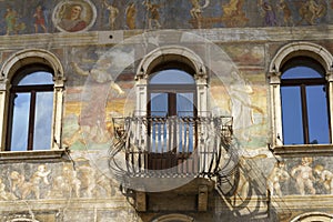 Trento, Italy: painted facade of historic buildings in the cathedral square