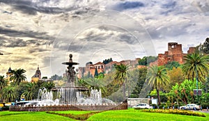 Tres Gracias Fountain and Alcazaba Castle in Malaga - Adalusia, Spain photo