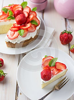 Mexican soaked cake topped with strawberries and cream photo
