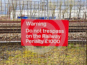 Trespass warning sign and penalty notice at railway photo
