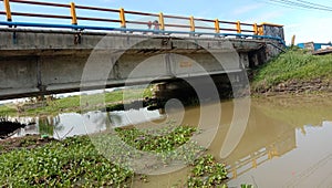 Trespassing bridge for transportation between villages lots of vehicles passing by