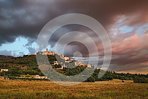 Trevi, Perugia, Umbria, Italy: landscape at sunset of the hill town under a dramatic cloudy sky