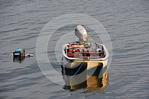 Tri Hull Whaler Boat Tied on a Mooring photo
