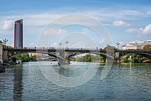Triana Bridge at Guadalquivir River and Sevilla Tower (Torre Sevilla) - Seville, Spain