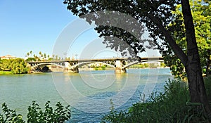 The Triana Bridge on the Guadalquivir River in Seville Andalusia Spain