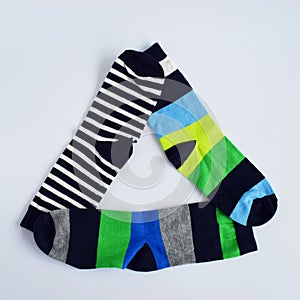 Triangle of colorful socks on pure white background