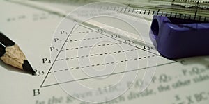 triangle shape on geometric shapes displayed on white paper with tools