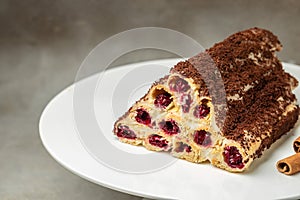 triangular cake with cherries on plate. Food recipe background. Close up
