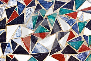 Triangular colorful mosaic texture on wall