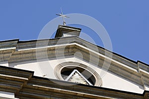 Triangular pediment with the All-Seeing Eye bas-relief. Catholic church of St.Anne. Krakow