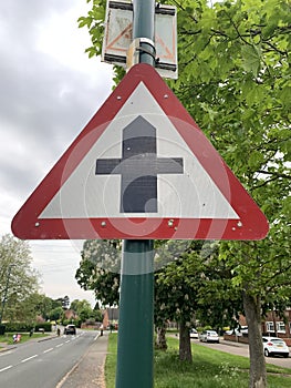 Triangular road sign warning motorists of junction ahead UK