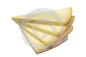 Triangular slice of old cheddar cheese. Piece of yellow cheese with sliced pieces on white background