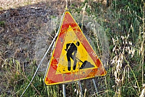 Triangular traffic sign which indicates work in progress on the road Italy, Europe