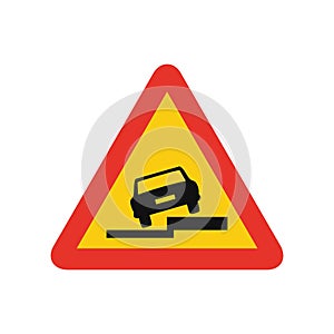 Triangular traffic signal in yellow and red, isolated on white background. Temporary warning of side slope on the right photo