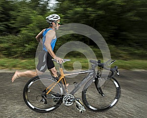Triathlete with a bicycle photo