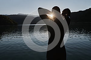 Triathlon athlete starting swimming training on lake