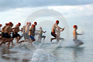Triathlon swim race blur photo