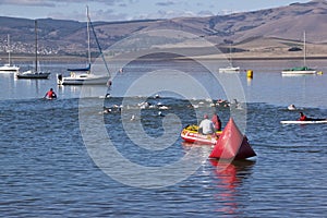 Triathlon Swimmers Watched Over by Inflatable Rescue Boat