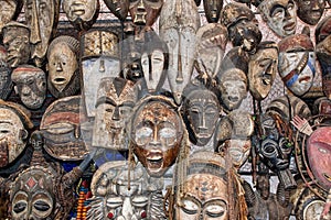Tribal African masks displayed at a traditional Moroccan market, souk, in Marrakech. Morocco, Africa
