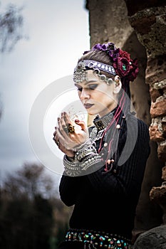 Tribal woman portrait outdoors in autumn trees