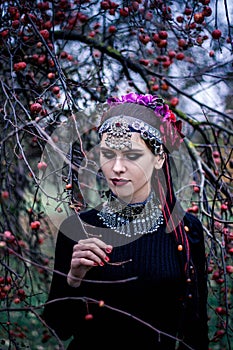 Tribal woman portrait outdoors in autumn trees