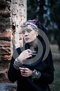 Tribal woman portrait outdoors in autumn trees