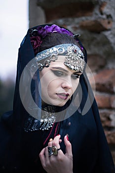 Tribal woman portrait outdoors in autumn trees