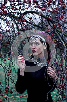 Tribal woman portrait outdoors in autumn trees