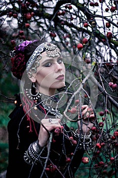 Tribal woman portrait outdoors in autumn trees