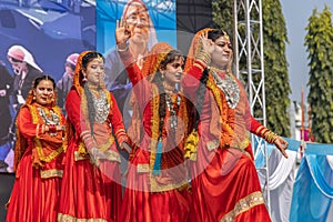 Tribal women of Uttarakhand wearing traditional attire and dancing