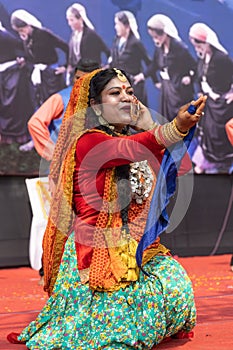 Tribal women of Uttarakhand wearing traditional attire and dancing