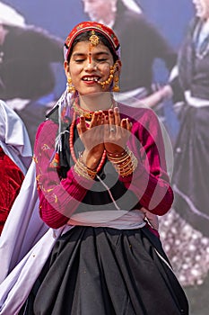 Tribal women of Uttarakhand wearing traditional attire and dancing