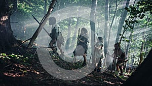Tribe of Hunter-Gatherers Wearing Animal Skin Holding Stone Tipped Tools, Explore Prehistoric Fore