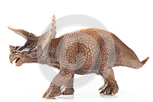 Triceratops plastic figurine in white background