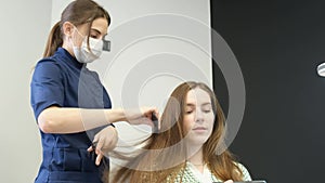 A trichologist-dermatologist who examines the patient's hair and looks at the damaged ends of the hair.