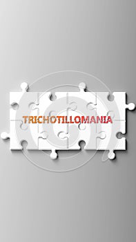 Trichotillomania complex like a puzzle - pictured as word trichotillomania on a puzzle pieces photo
