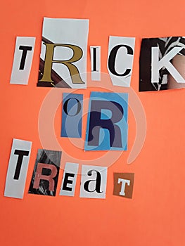 Trick or treat words letters collage on a orange background