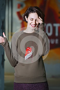 Tricky girl posing in olive fleece sweatshot photo