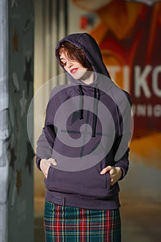 Tricky girl posing in violet fleece sweatshot with hood photo