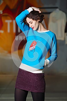 Tricky girl posing in blue fleece sweatshot photo