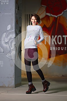 Tricky girl posing in white fleece sweatshot photo