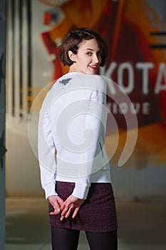 Tricky girl posing in white fleece sweatshot photo